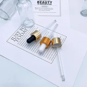 Glass dropper bottles wholesale empty cosmetic sample bottles with gold caps for oils.