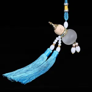 Blue tassel car hanging pendant with wooden and frosted glass gourd design for interior decor.