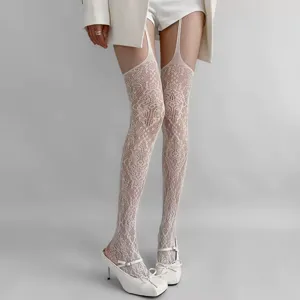 White lace suspender stockings for women, elegant floral pattern over-the-knee hosiery.