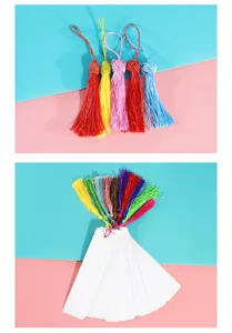 Close-up of colorful tassel bookmarks, vibrant threads paired with blank white cardstock.