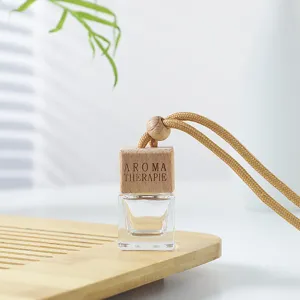 Flacon vide de parfum de voiture pendentif diffuseur d'huile essentielle avec bouchon en bois.