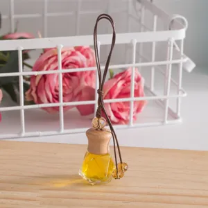 Crystal car perfume bottle pendant detail shot, glass hanging aromatherapy diffuser ornament.