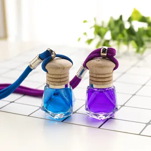 Car air freshener bottle pendant, multi-faceted glass with wooden cap and rope.