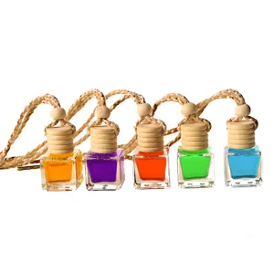 Car hanging perfume bottle aromatherapy diffuser glass bottle with wooden cap and colorful liquid.