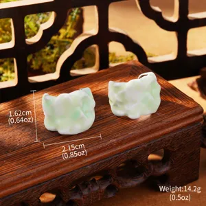 Macro view of Monet style oil painting enamel earrings showing height width and weight measurements