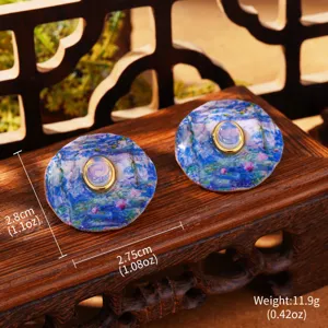 Detailed view of Monet-style water lily enamel earrings with size and weight specs