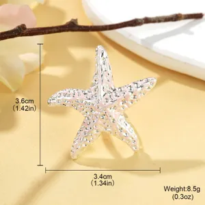 Vue macro détaillée de la bague étoile de mer rose avec infos taille et poids
