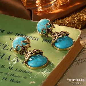 Detailed macro shot of vintage French court style turquoise earrings on a classic book