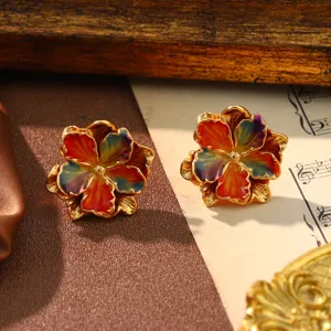 Detailed view of vintage palace style flower earrings featuring colorful enamel petals