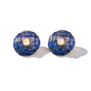 Detailed macro of Monet's Water Lilies enamel earrings with elegant gold bezel