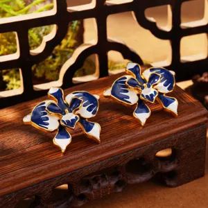 Detailed view of Monet-inspired blue and white enamel flower earrings in French vintage style
