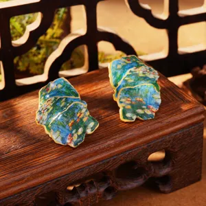 Detail of French retro enamel earrings with Monet's Water Lilies oil painting pattern