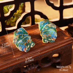 Macro view of Monet style Water Lilies enamel earrings showing size 3.1x2.0cm and weight