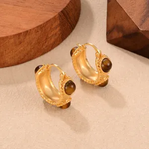 Vintage C-shaped hoop earrings with brown tiger eye stones in a gold-toned finish