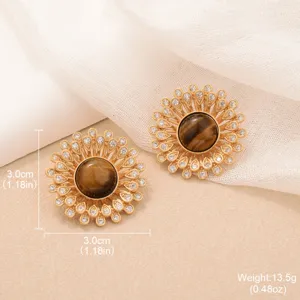 Detailed view of vintage gold sunflower earrings featuring natural tiger eye center stone