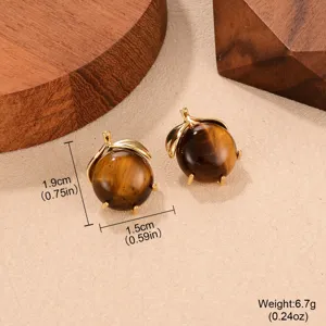 Close-up detail of vintage tiger eye earrings showing precise size and weight data