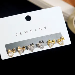 Drie paar elegante oorknoppen met strikjes en sprankelende zirkoniasteentjes voor dames