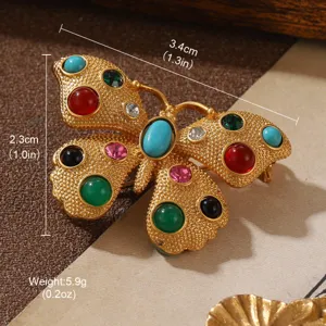 Detailed view of vintage butterfly brooch with colorful stones and 3.4cm dimensions