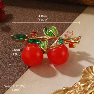Detail of vintage cherry brooch with dimensions 4.0cm x 2.5cm and weight 25.35g