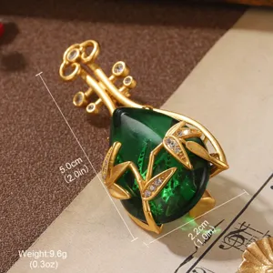 Vintage lute brooch with green stone and bamboo detail, dimensions 5.0x2.2cm.