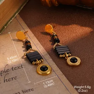 Detailed view of vintage gold and black drop earrings with size and weight measurements