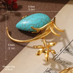 Vintage gold flower brooch with turquoise stone showing dimensions 5.5cm x 5.0cm