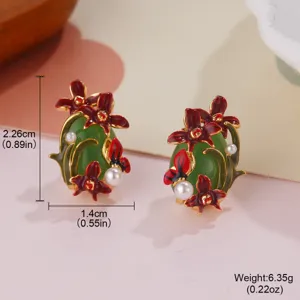 Close-up detail view of elegant vintage enamel flower earrings with white pearls