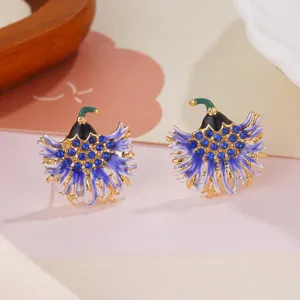 Close-up of elegant blue enamel flower earrings with sparkling crystal accents