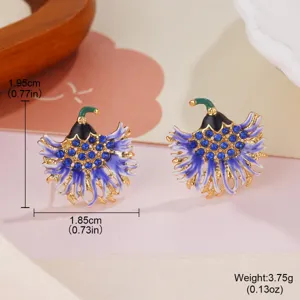Detailed macro view of elegant blue enamel flower earrings with sparkling blue crystals