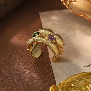 Vintage gold textured ring with multi-color zircon stones macro view