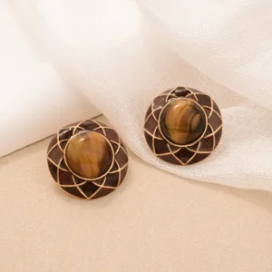 Close-up of retro sunflower tiger's eye earrings with Maillard brown enamel finish