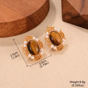Detail view of vintage tiger's eye earrings with pearls and size labels