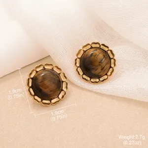 Detailed view of vintage gold tiger eye earrings with sunflower petal design.