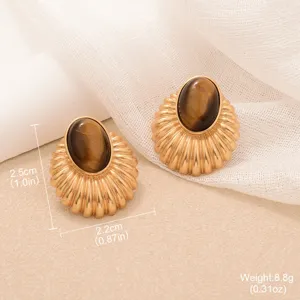 Detail shot of vintage gold tiger eye earrings with sunflower design and measurements.
