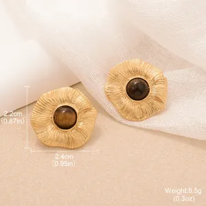 Macro shot of vintage gold sunflower earrings with tiger eye stone and dimensions