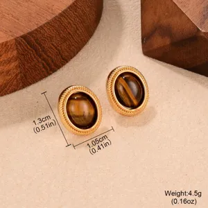 Detailed view of vintage gold-toned oval tiger eye stud earrings with size and weight