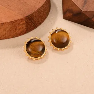Detailed view of vintage gold tiger's eye earrings with ornate beaded border