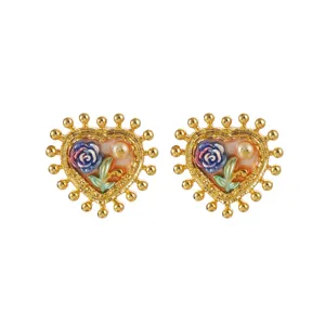 Vintage French Baroque heart earrings with rose and pearl details on white background