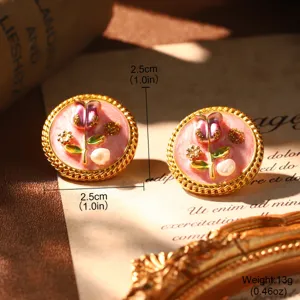 Macro detail of French court style enamel earrings with natural pearl decoration