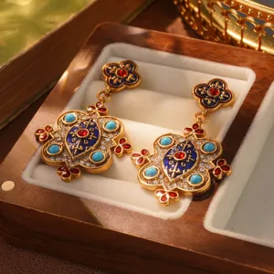 Detail of vintage French court style earrings with blue enamel and turquoise beads