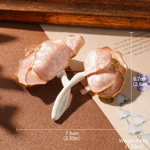Detailed view of a vintage pink floral brooch showing dimensions of 7.5cm by 6.7cm