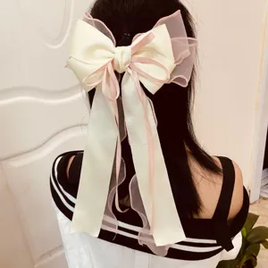 Elegant oversized cream ribbon bow hair clip with pink mesh layers for women