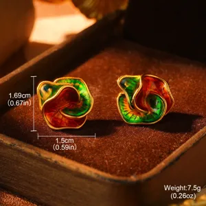 Macro view of vintage oil painting style rainbow enamel 3D stud earrings in a box.