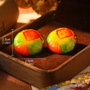 Close-up view of vibrant oil-painted enamel stud earrings with size and weight details