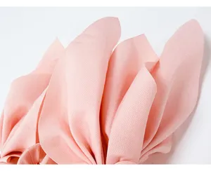 Macro detail of the high-quality textured fabric on the pink bow hair claw clip.