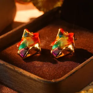 Detailed macro view of vintage oil painting style 3D stud earrings with colorful enamel
