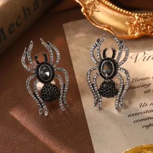 Vintage silver-tone spider ear studs with sparkling black and white crystals