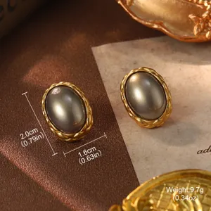 Detailed view of vintage gold-tone oval earrings with size and weight specifications