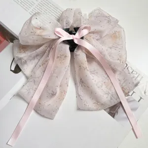 Elegant floral chiffon bow shark clip with sparkling rhinestones and pink silk ribbons.