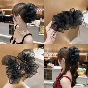 Elegant black feather mesh hair claw clip detail showing puffy cloud design and model updo